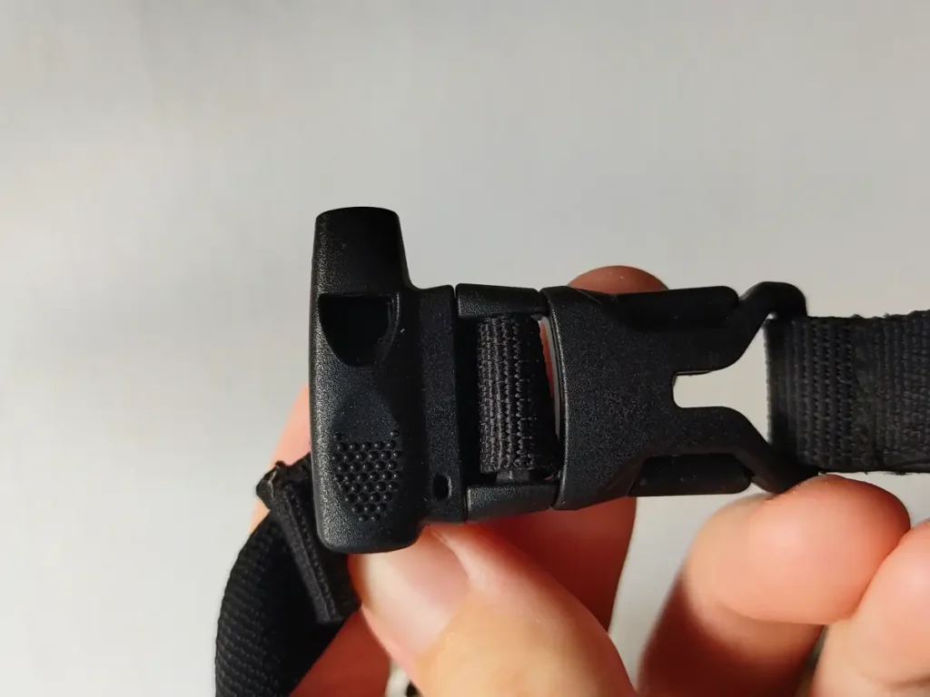 Whistle integrated into backpack buckle